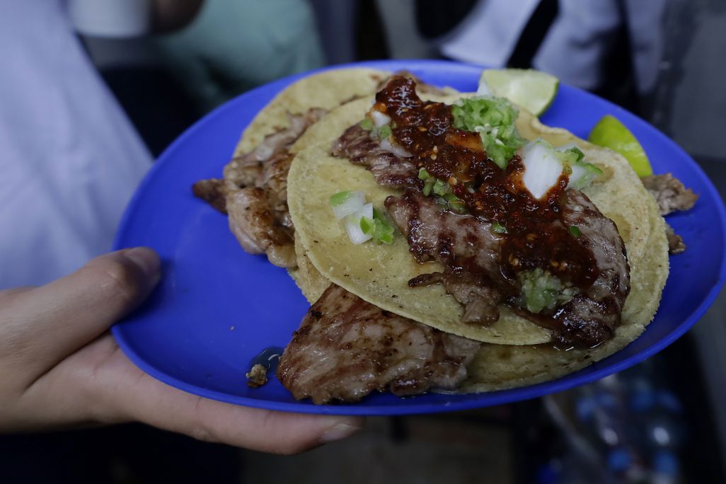 Blue plate with tacos on them