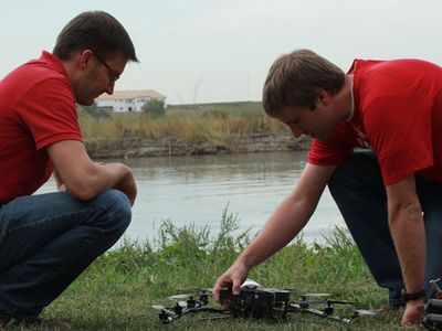 University of Nebraska-Lincoln researchers Matt Waite (left) and Carrick Detweiler use a Falcon 8 UAV to document the effects of drought on the Platte River.