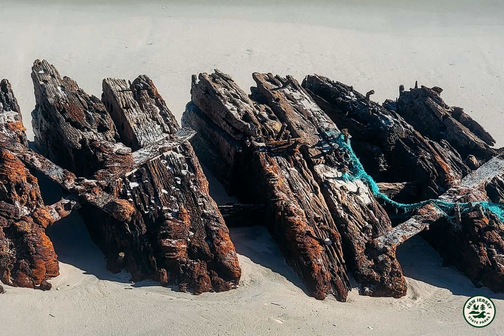 A piece of an old shipwreck on sand