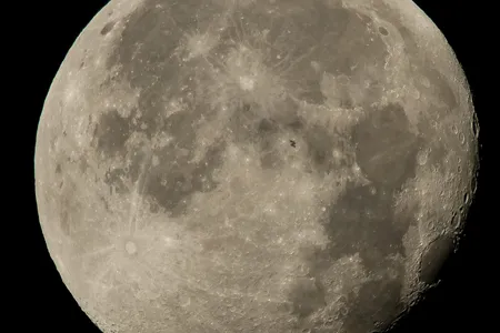 One glorious memorial (The Moon on August 2, 2015 with the International Space Station just visible as a silhouette)