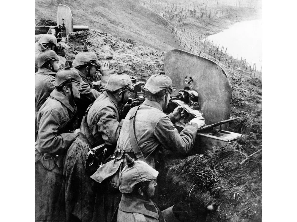 German infantrymen aim machine guns from a trench near the Vistula River in 1916.