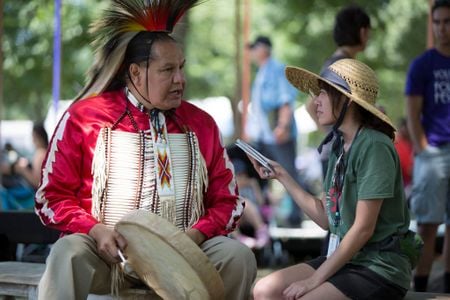 Elisa Hough interviews Dennis Zotigh (Kiowa/San Juan Pueblo/Santee Dakota), a cultural specialist at the National Museum of the American Indian. (Daniel Martinez, Center for Folklife and Cultural Heritage, Ralph Rinzler Folklife Archives.)