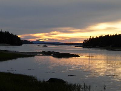The east side of Deer Isle is called Sunshine and is home to beautiful vacation houses, as well as some of the country's largest lobster-holding tanks. Sylvester Cove is in Sunset, on the island's western side, which is also home to the Island Country Club, where the roadside sign proclaims "public welcome."