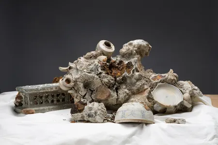 This concretion, recovered from the Hoi An shipwreck, alludes to the fate of artifacts left underwater. 