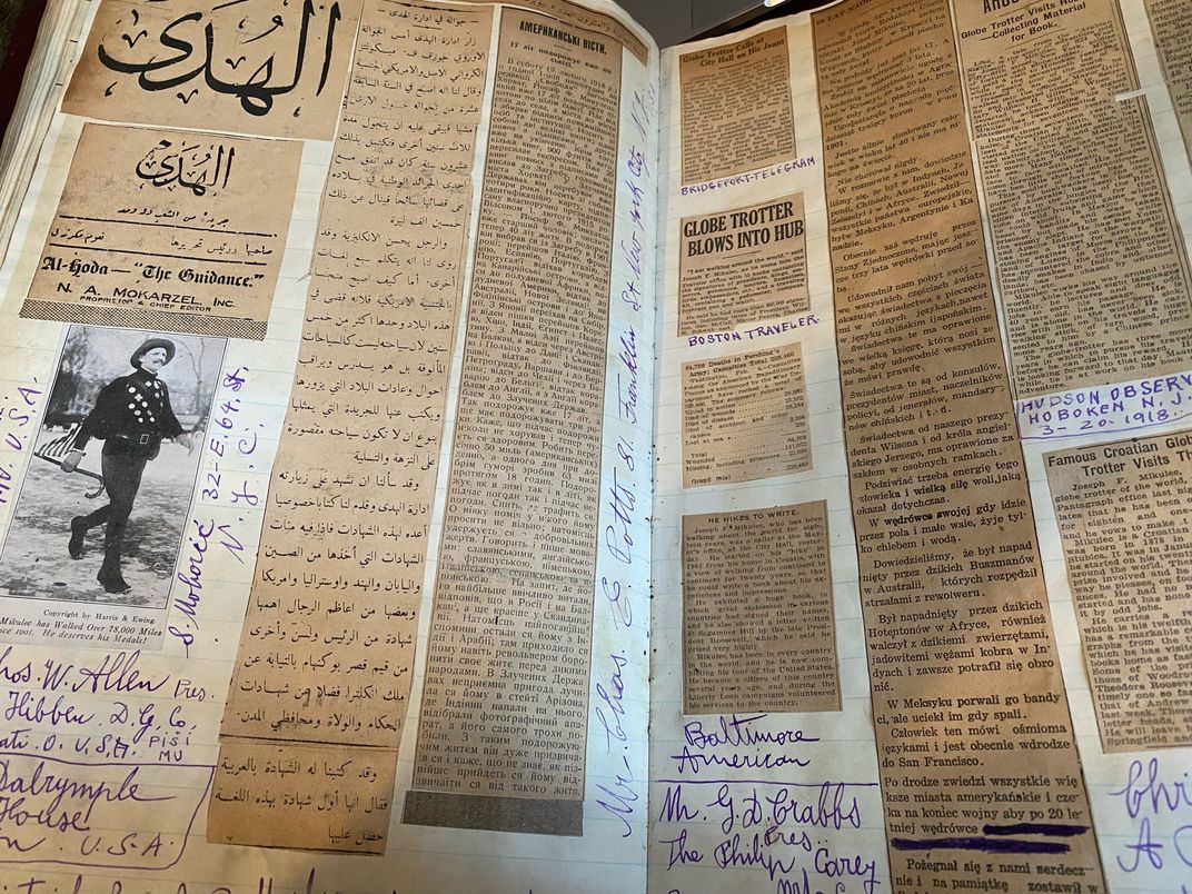 View of newspaper article clippings in the autograph book