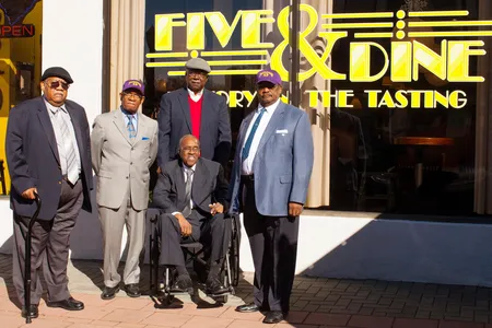 Friendship Nine members Clarence Graham, Willie Thomas Massey, David Williamson Jr., James F. Wells and Willie E. McCleod (L-R) stand in front of the renamed Five & Dine diner in Rock Hill, South Carolina, on December 17, 2014