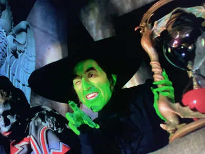 The Wicked Witch of the West, played by Margaret Hamilton, holding the hourglass