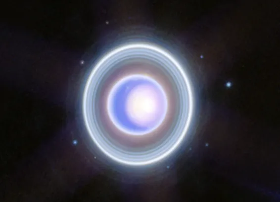Uranus appears blue-purple with lots of rings around it and nine dots, which are its moons
