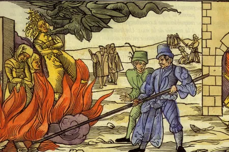 A 14th-century illustration depicts accused witches being burned at the stake. More than 2,500 witches were executed under Scotland's 1563 Witchcraft Act.