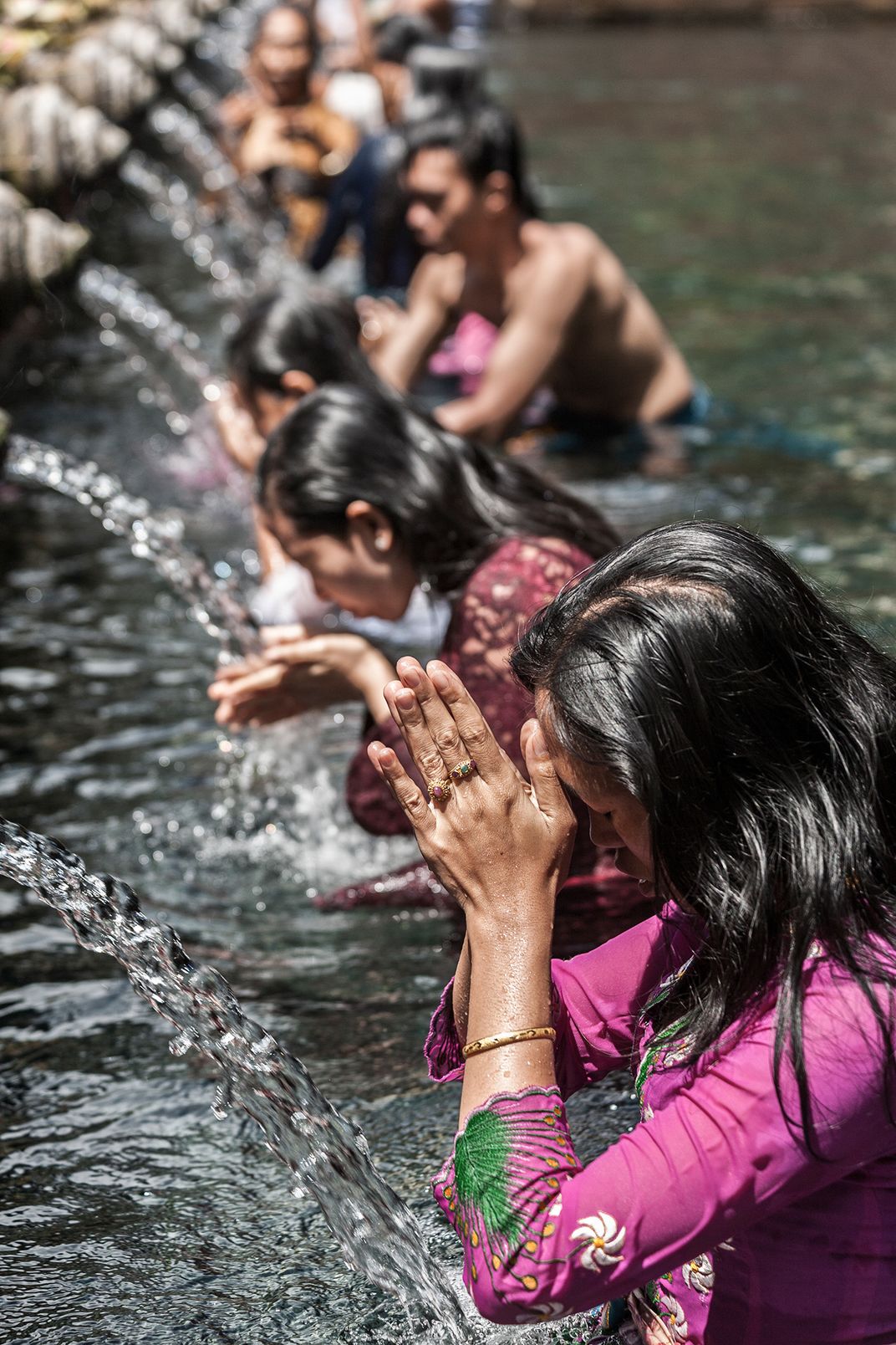 Purification ceremony in Tirta Empul Temple, Bali Smithsonian Photo