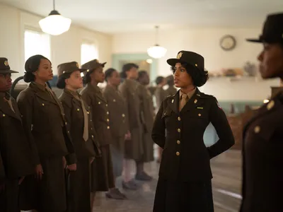 Kerry Washington reviews a line of Women's Army Corps officers
