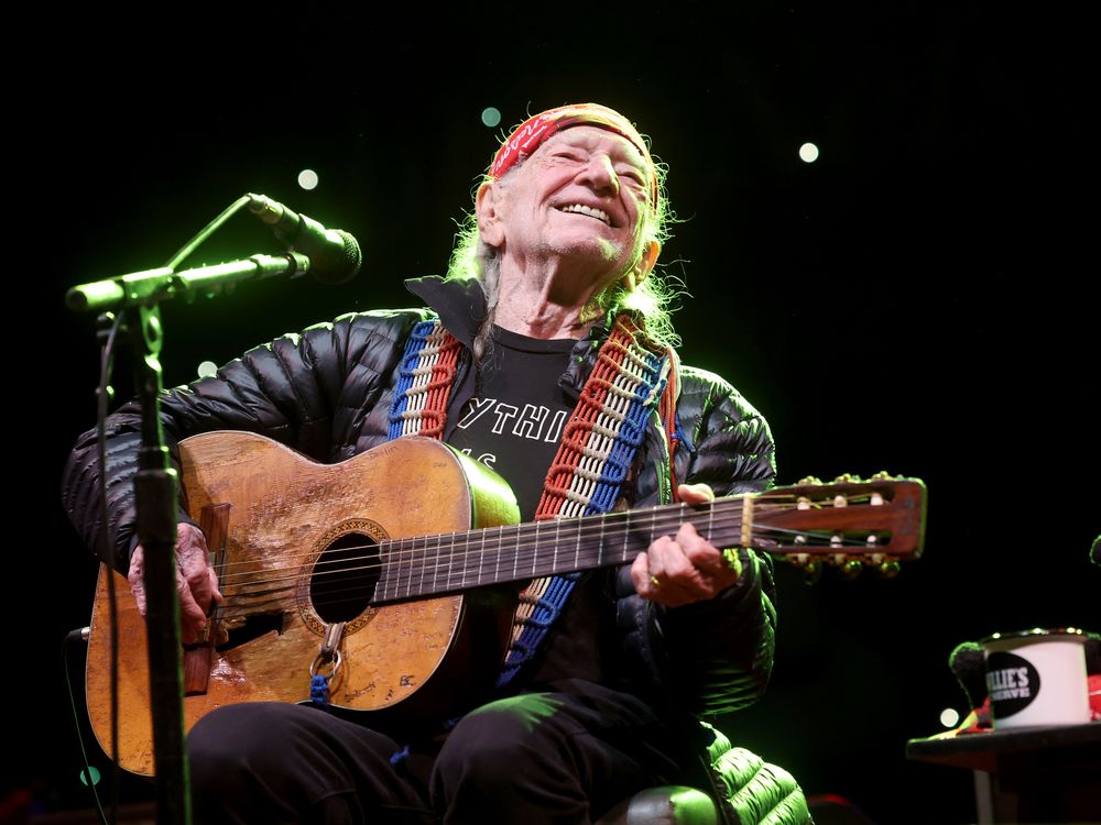 willie nelson playing guitar