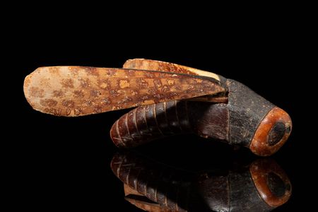 Measuring just 3.5 inches long, the grasshopper is carved from ivory and wood.