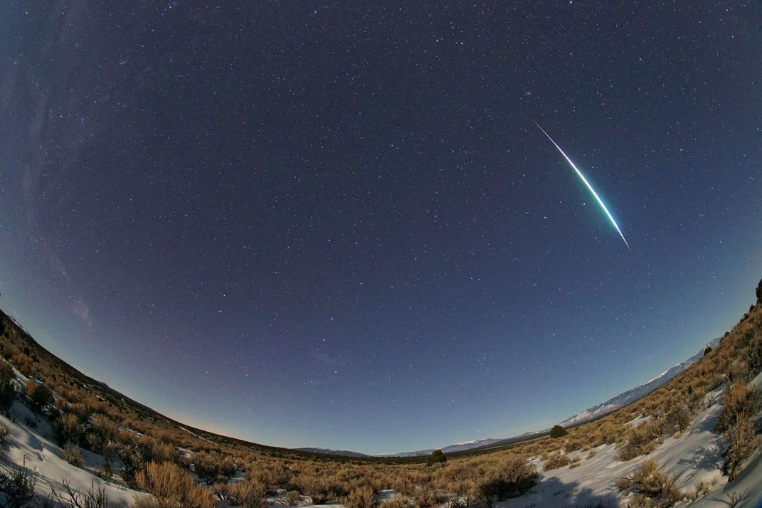 Meteor streaking through the night sky