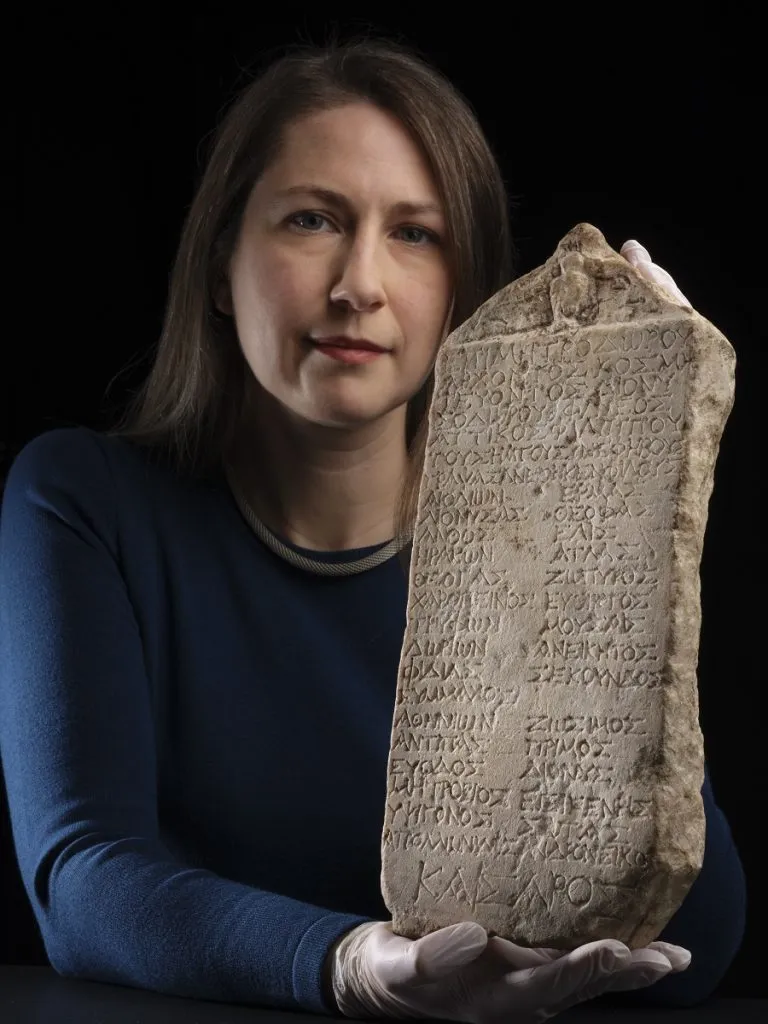 Dr. Margaret Maitland, a top curator at the National Museums Scotland, pictured with the Athenian ephebic stone tablet.