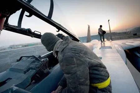 Airmen prepare an F-15E Strike Eagle for flight Jan. 4, 2011, at Bagram Airfield, Afghanistan. They are deployed from Seymour Johnson Air Force Base, N.C. (U.S. Air Force photo/Staff Sgt. Robert Barney)
