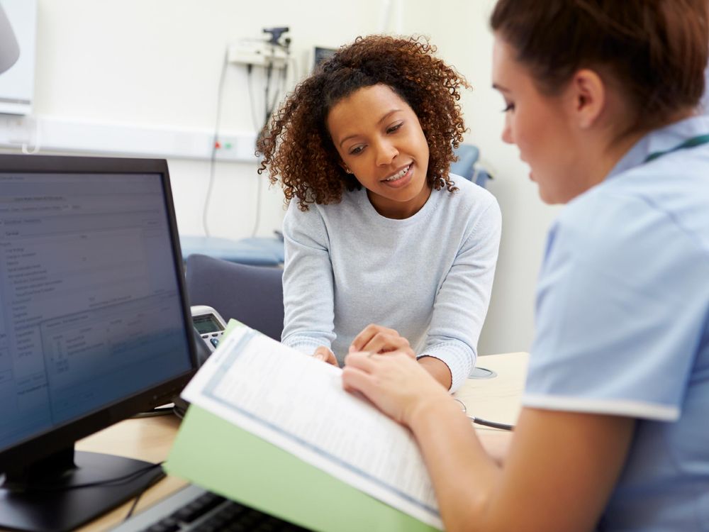 Nurse Talking to Patient About Test Results