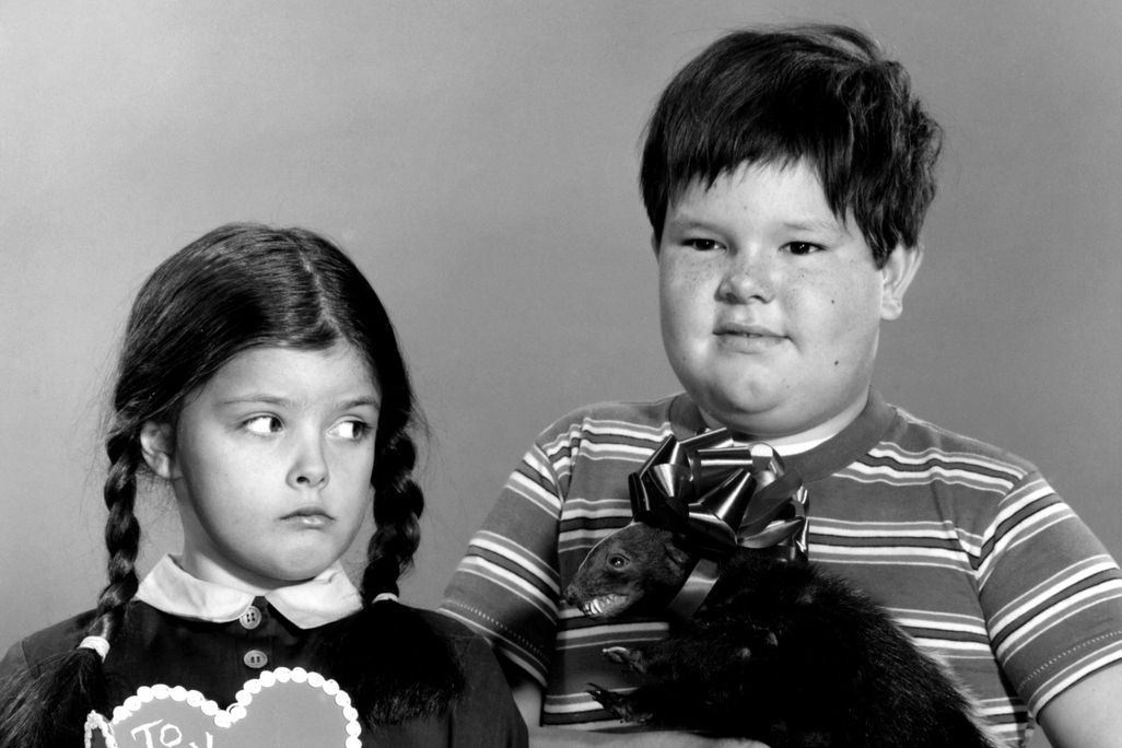 Wednesday ( Lisa Loring ) poses holding a valentine with her Brother Pugsley (Ken Weatherwax) holding a Taxidermied animal