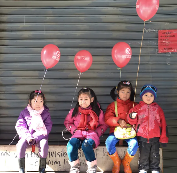 Kids with a red ballon thumbnail