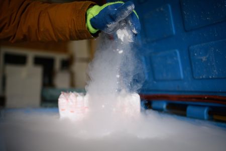 The vaccine candidate produced by Pfizer and BioNTech is stable at minus 94 degrees Fahrenheit, so Pfizer developed a suitcase-sized box that uses dry ice to keep between 1,000 and 5,000 doses that cold for 10 days. 