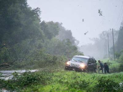 A vehicle stuck on the shoulder of a road near Mayo, Florida, as Hurricane Idalia crosses the state.