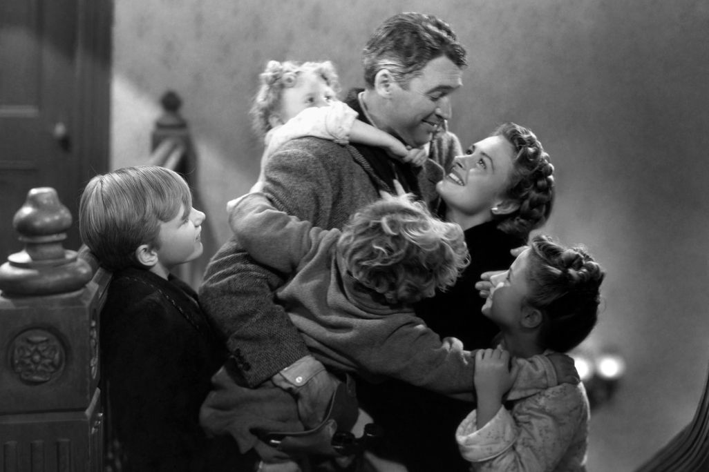 George and Mary Bailey, played by James Stewart and Donna Reed, hug their children in a still from "It's a Wonderful Life"