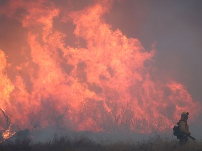 A firefighter works as the Hughes Fire burns north of Los Angeles on January 22.