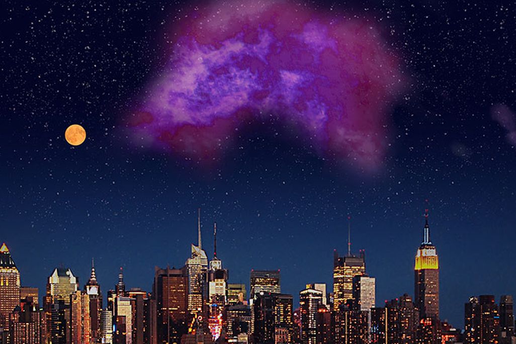 New York City skyline with a large purple cloud visible in the sky beside a bright full moon