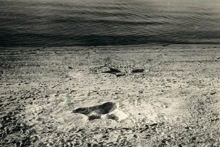 A photo of the two giant footprints that appeared on the shores of a Nantucket beach in August 1937.