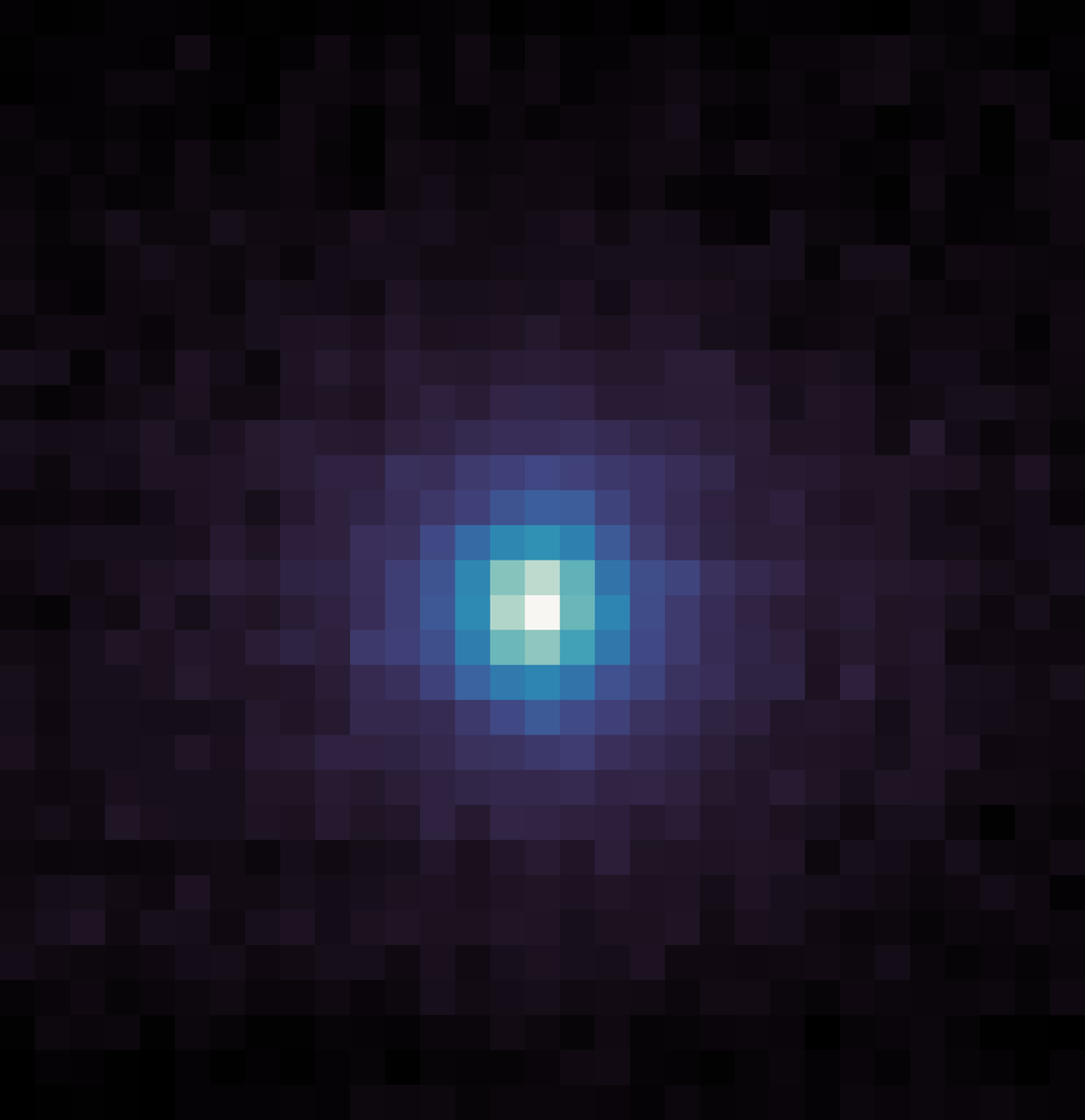 image showing a blue halo around a white dot, the comet