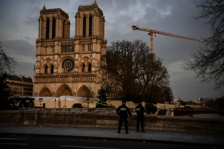 Policemen patrol the streets near Notre-Dame on March 17, 2020, as a strict lockdown comes into effect.