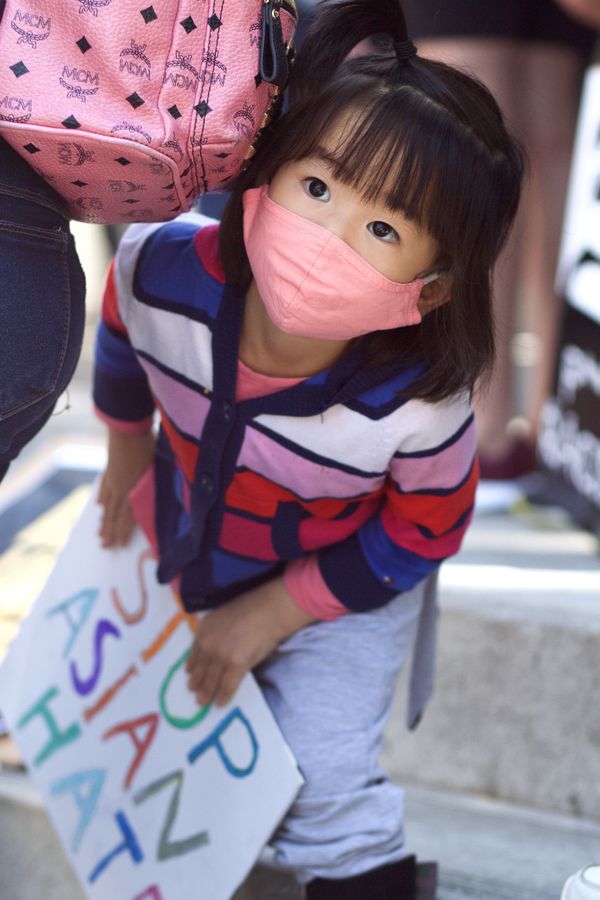 A young girl at the Stop Asian Hate rally in Los Angeles thumbnail