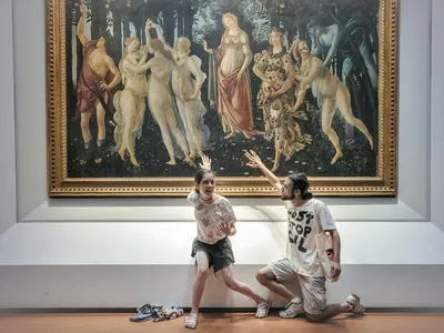 In July, protesters from Ultima Generazione glue their hands to the glass covering of Sandro Botticelli&#39;s Primavera.