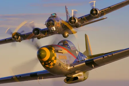 ★ North American P-51 Mustang ★ Most people who know warbirds consider the P-51 (foreground, flying with a B-17 during a 2009 demonstration) the best fighter of World War II. It was conceived in April 1940, when the Royal Air Force asked North American Aviation to build more Curtiss P-40s. North American’s President Dutch Kindelberger countered with an offer to deliver a wholly new design, and the first Mustang flew six months later. In the following year, the addition of a Merlin 61 engine (upgraded in later models) gave the XP-51B the combination of range and speed that would come to secure the P-51’s legend. Escorting bombers to Berlin and whupping the German fighters that attacked them, the P-51 was significant in weakening the German air force.