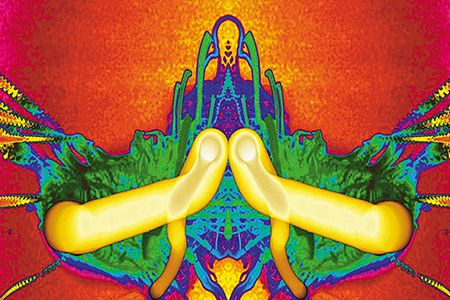 A composite false-color image of fire in space. The bright yellow traces the path of a drop of fuel, shrinking as it burns, producing green soot.