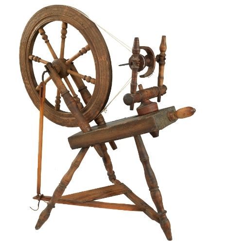 wooden spinning wheel on white background