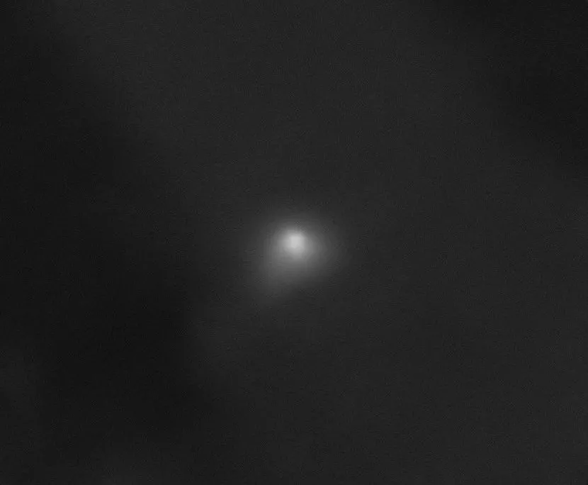 image of comet with a faint glow around it