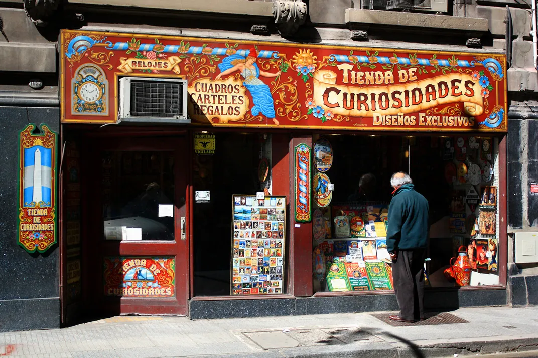 A man looks into a storefront
