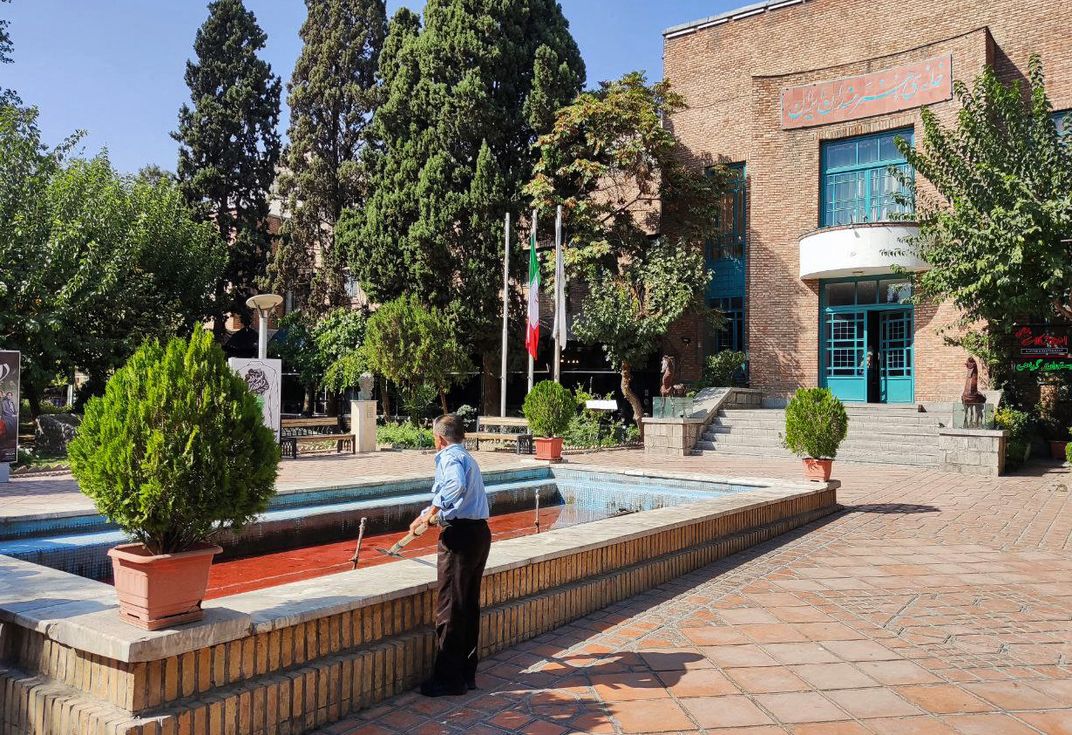 A fountain with its water dyed red outside the Artists' Forum at Honarmandan Park in the Iranian capital Tehran