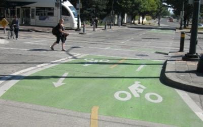 Simple but safe: An elaborately painted bike lane in Portland marks among the few places on America’s roadway system where cars are not allowed.