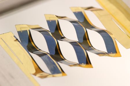 Kirigami-cut solar cells