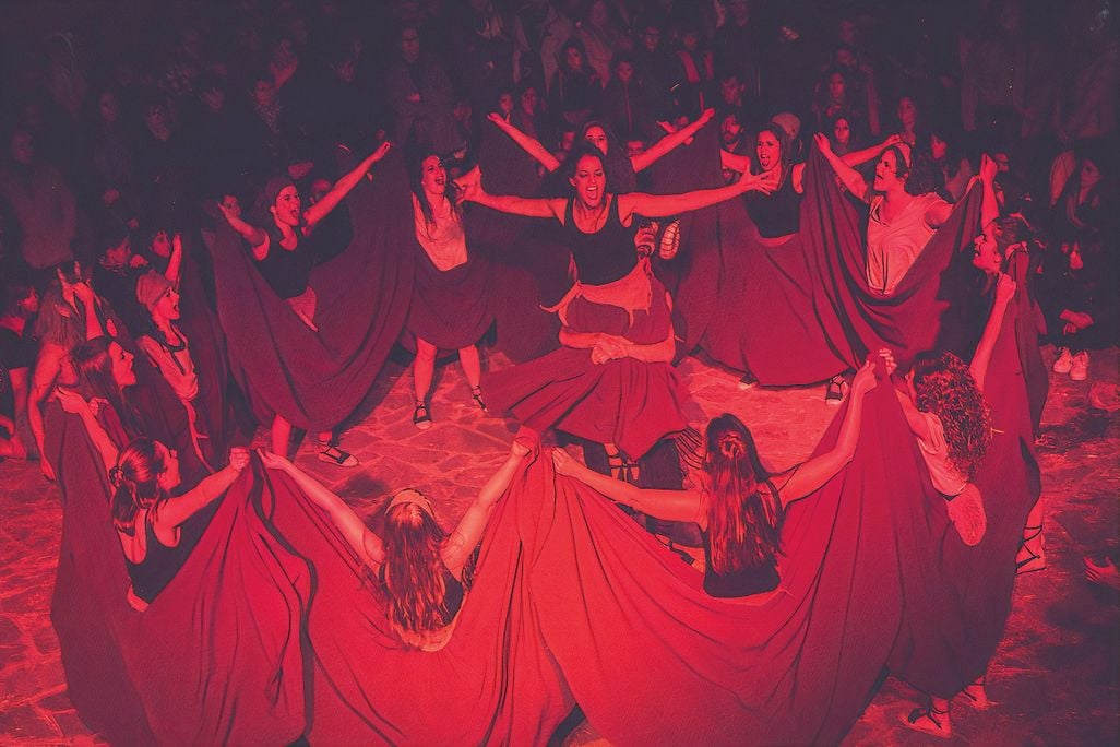 dancers join hands in a circle formation