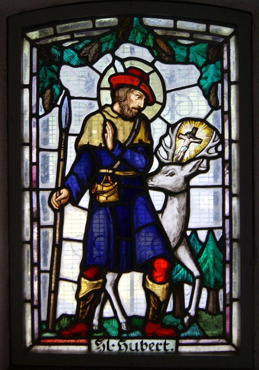 A stained-glass portrait of Saint Hubert, whose relics were believed to cure rabies