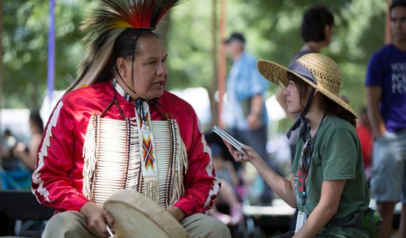 Elisa Hough interviews Dennis Zotigh (Kiowa/San Juan Pueblo/Santee Dakota), a cultural specialist at the National Museum of the American Indian. (Daniel Martinez, Center for Folklife and Cultural Heritage, Ralph Rinzler Folklife Archives.)