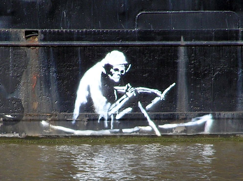 Stencil by Banksy on the waterline of The Thekla