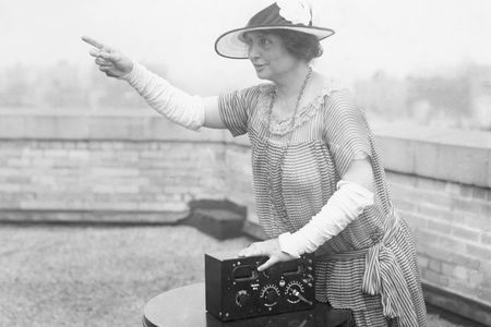 Helen Keller in a photograph taken to promote her efforts to give radios to poor blind children.
