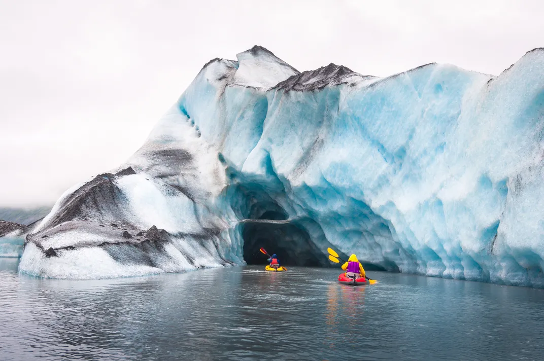 kayakers explore Valdez Glacier in Alaska