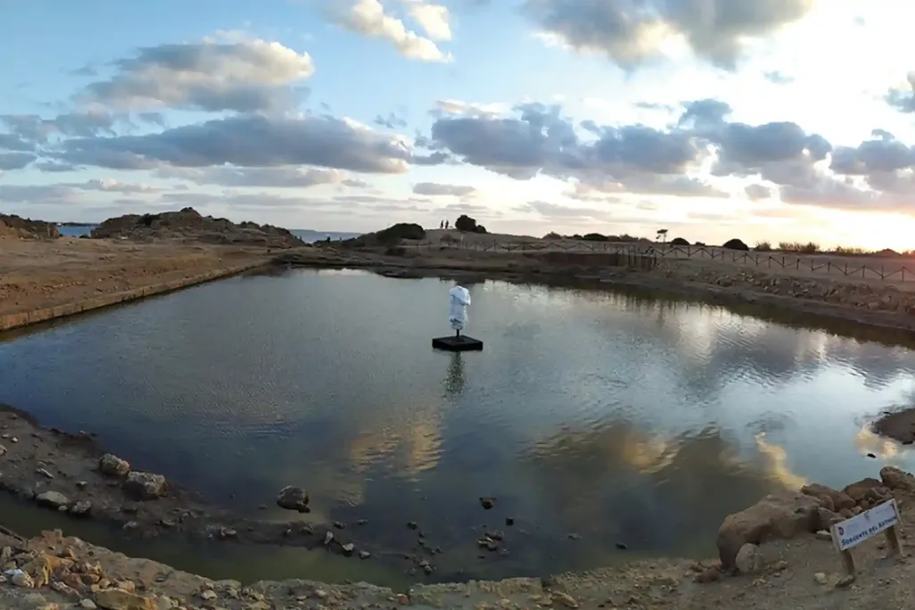A reflective pool looking out on the Mediterranean Sea