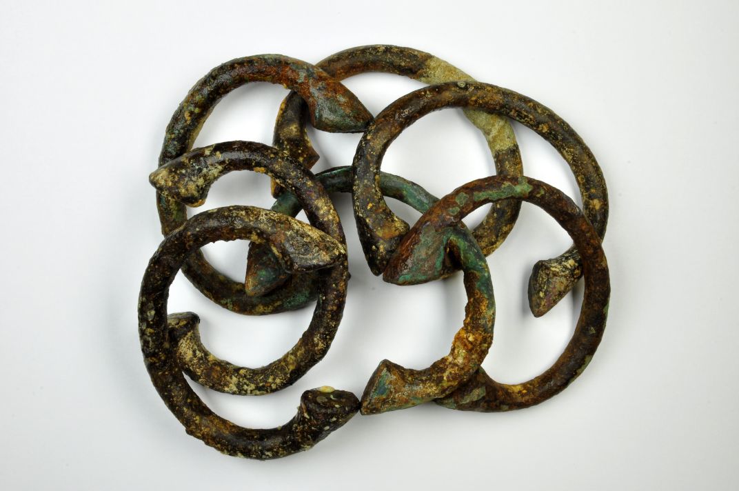 Copper manilla bracelets used as trading currency, recovered from a slaver wreck in the Western Approaches to the English Channel