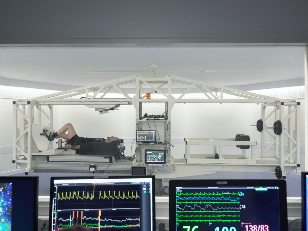 Man lying down while cycling in a lab